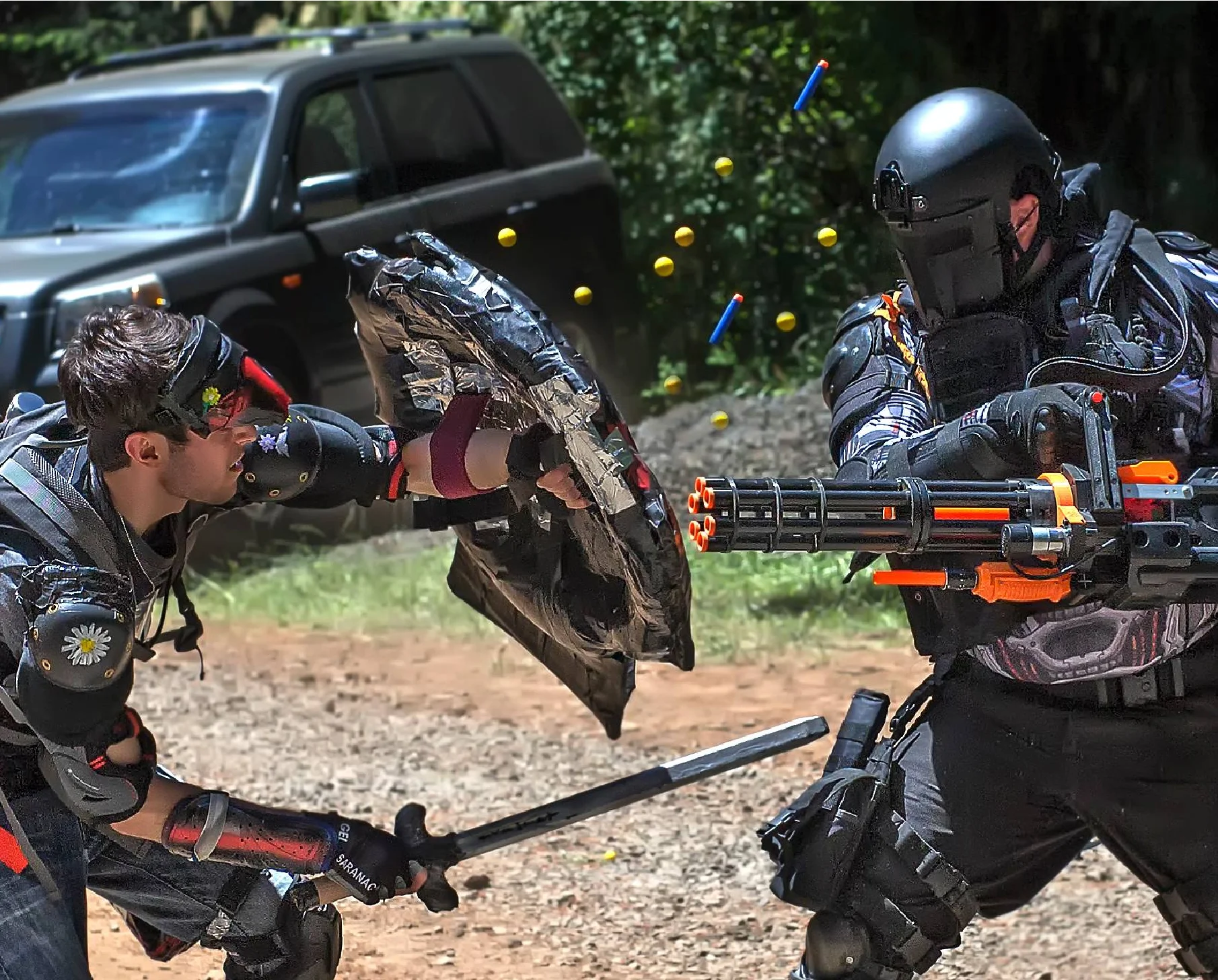 Two heavily armored warriors locked in larp combat.